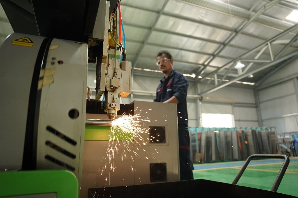 Thimark machinists and fabricators at work across the factory floor